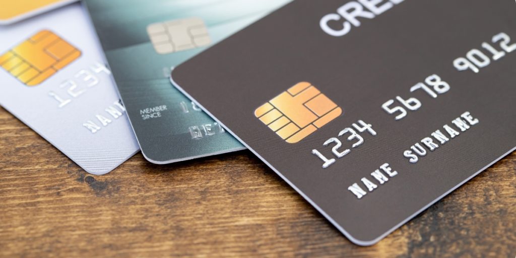 Close-up of three credit cards on a table
