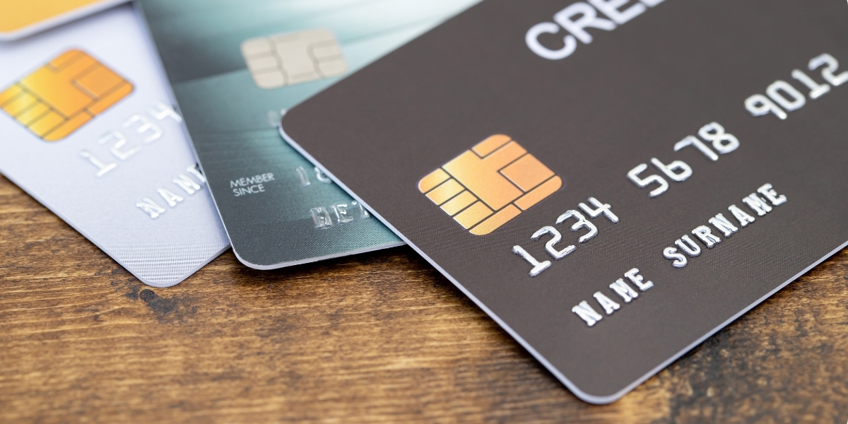 Close-up of three credit cards on a table