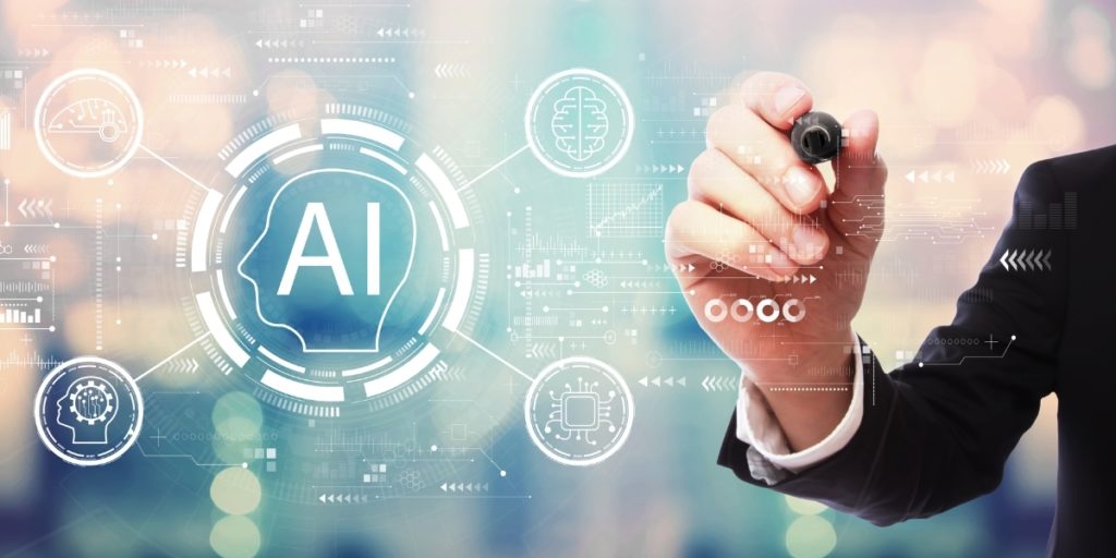 Close-up of a person's hand and the text "AI"