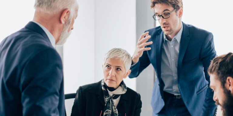 Group of older executives talking