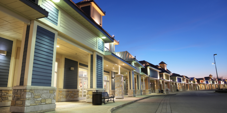 Street of shops with lights on