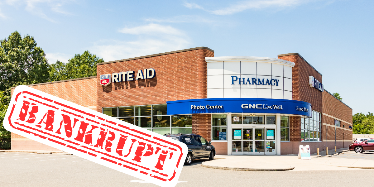 Image of the front of a Rite Aid with a "Bankrupt" sticker on top