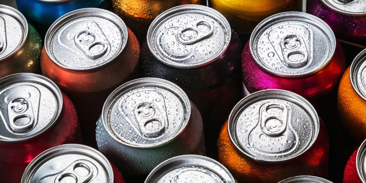 Close-up of the tops of soda cans