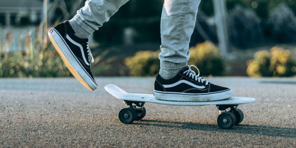 Close-up of someone riding on a skateboard in Vans